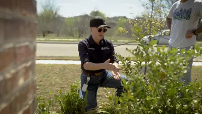 Water Conservation Coordinator Jess Wright works with a Kyle resident, looking over their sprinkler system and identifying ways they can potentially conserve water. 