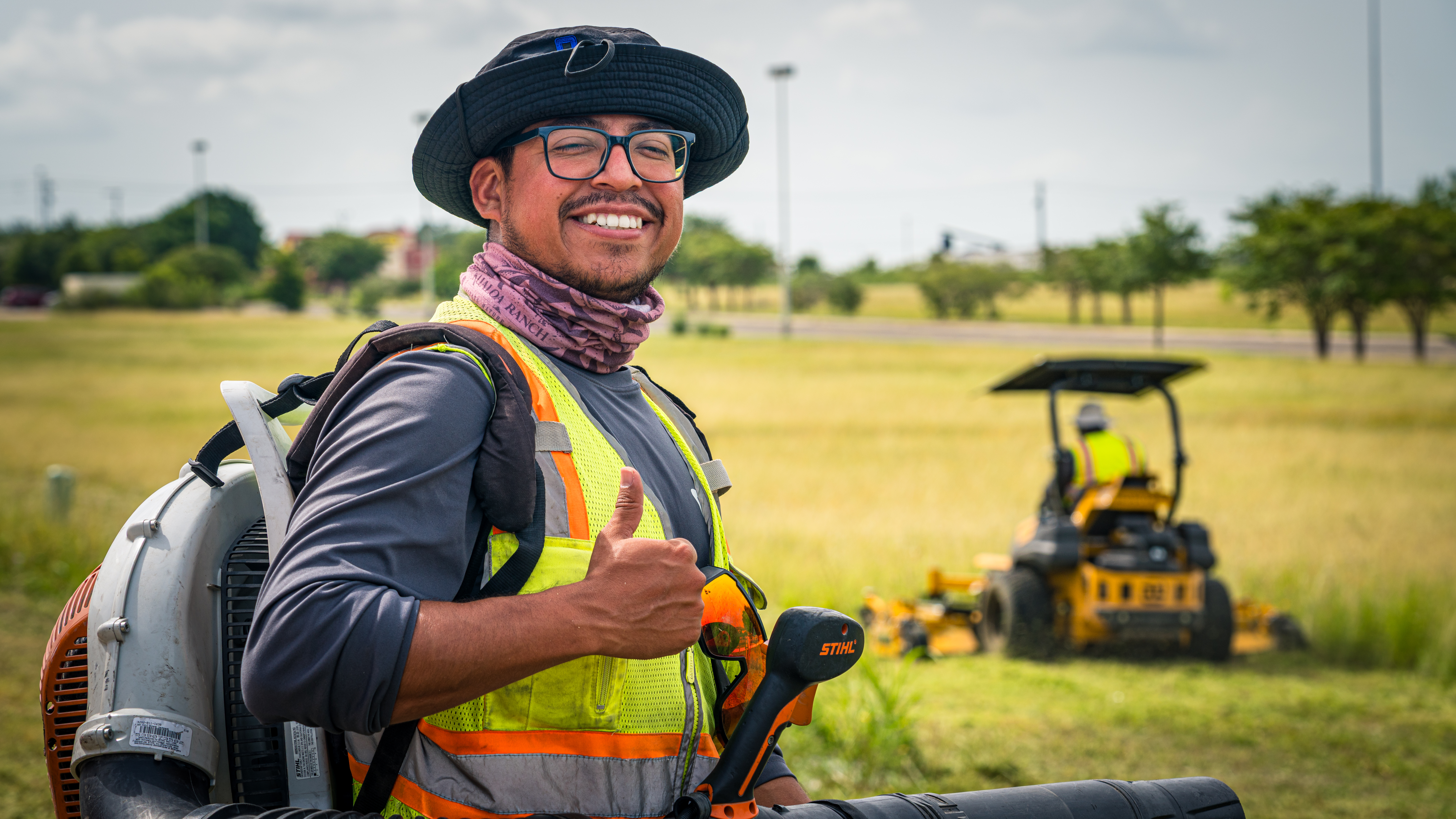 City of Kyle employee smiling and giving a "thumbs up"