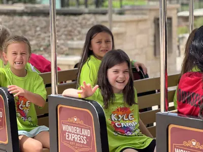 Children riding a train at the park