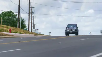 A picture of a vehicle driving North on Dacy Lane in Kyle, Texas. 