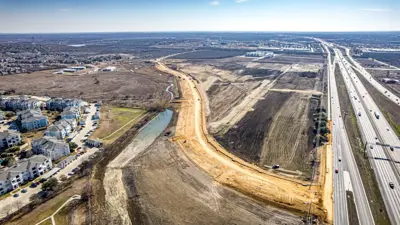 A drone shot of a road being constructed east of I-35 in Kyle. The road is the Kohlers Crossing extension. 
